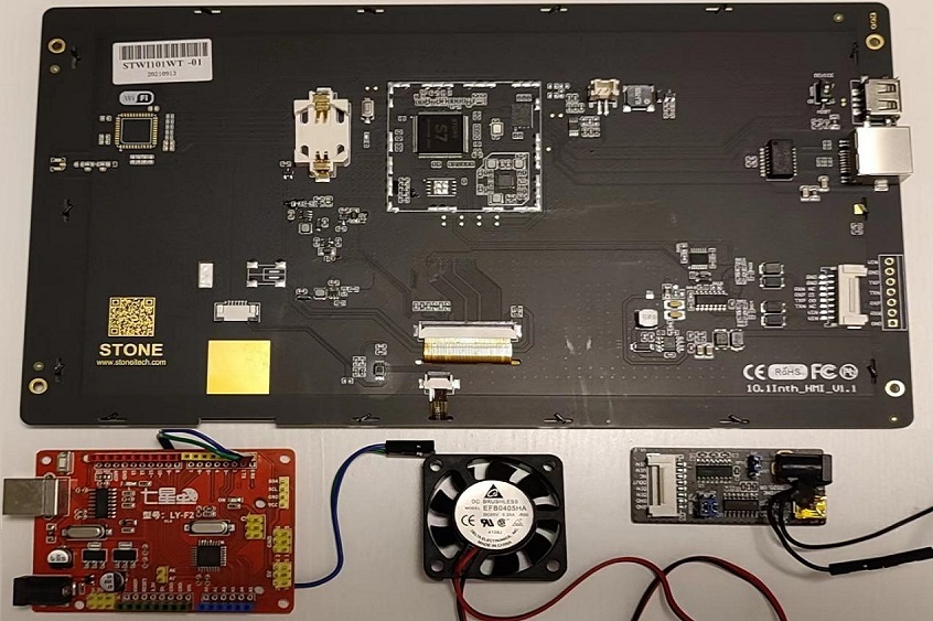 a circuit board with wires and fan